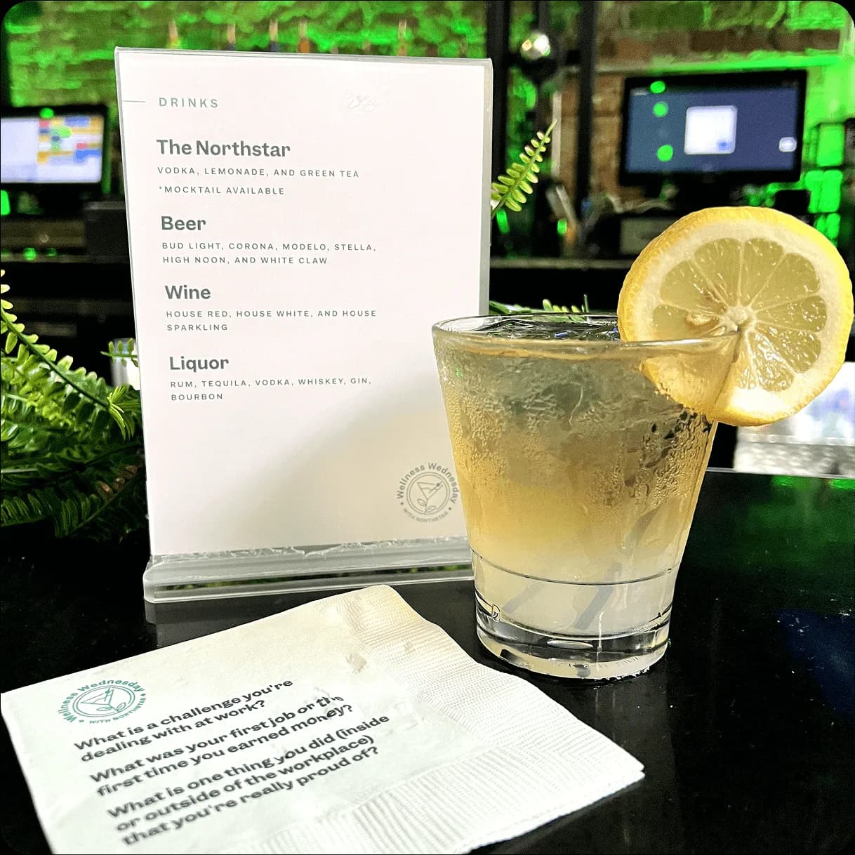 This is an example of a signature drink, a custom drink menu, and custom conversation-starter napkins planned for a happy hour.